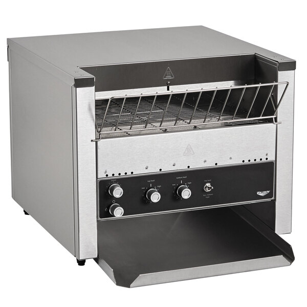 A stainless steel Vollrath conveyor toaster on a counter.