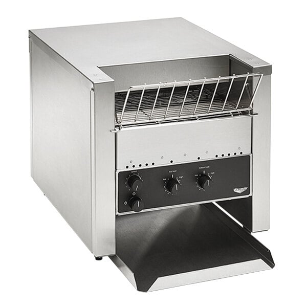 A stainless steel Vollrath conveyor toaster with a rack.