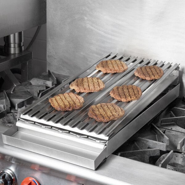 A group of hamburger patties cooking on a 12 1/4" x 27" Add-On Charbroiler.