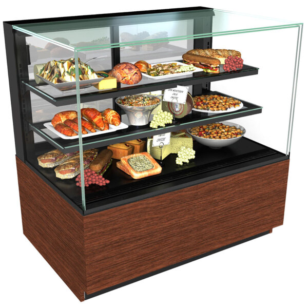 A Structural Concepts refrigerated bakery display case with food on shelves.