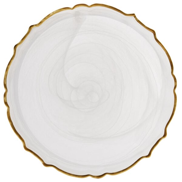 A white Charge It by Jay glass charger plate with a gold trim on the scalloped edge.