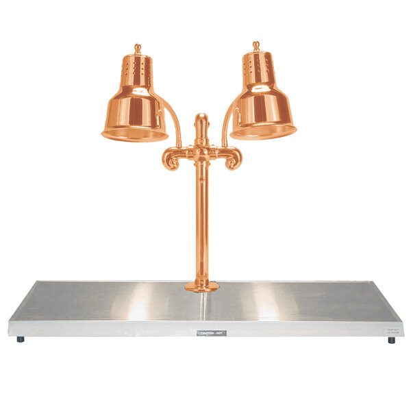 A Hanson Heat Lamps bright copper carving station with two copper lamps over a metal shelf.