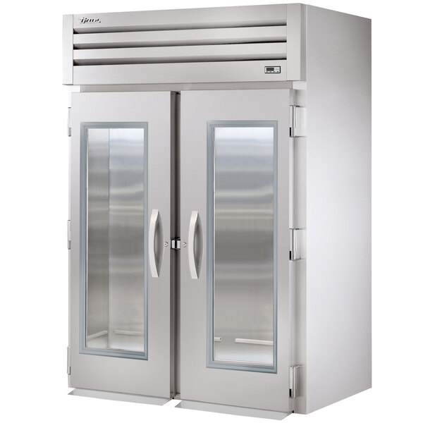 A True Spec Series glass door roll-in refrigerator with stainless steel doors.