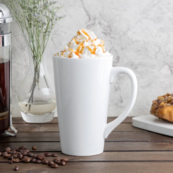 A white Libbey tall bistro mug filled with coffee and whipped cream.