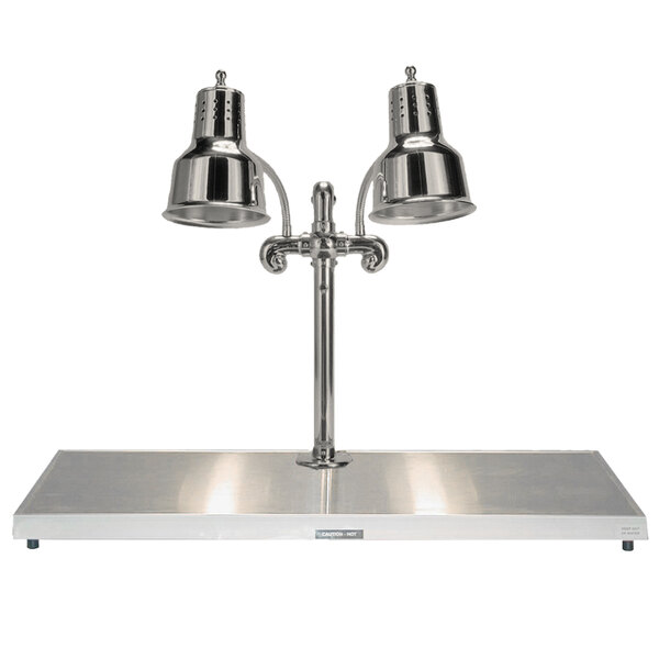 A Hanson Heat Lamps stainless steel carving station with two chrome lamps above a metal surface.