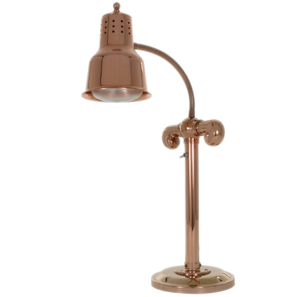 A close-up of a Hanson bright copper countertop heat lamp with a curved tube and a round base.