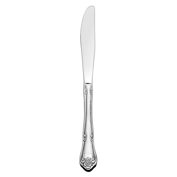 A Oneida Arbor Rose stainless steel dinner knife with a handle.