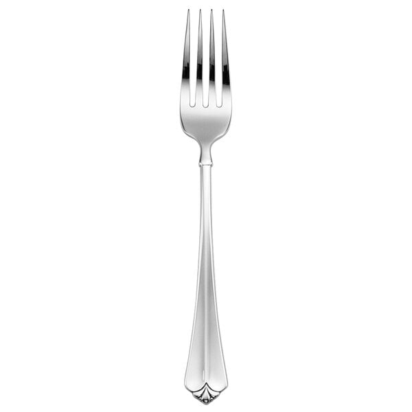 An Oneida Juilliard stainless steel table fork with a silver handle.