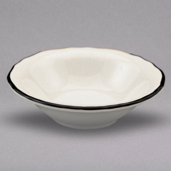 A white Homer Laughlin china bowl with a black rim.