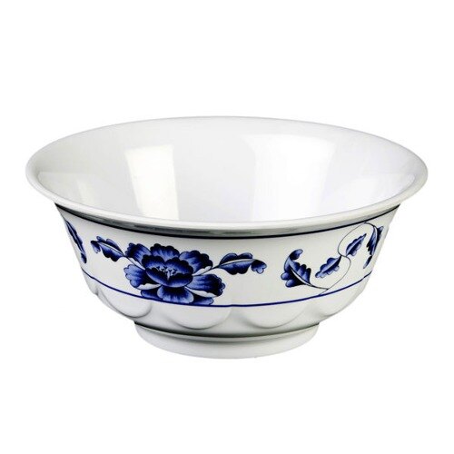 A white bowl with blue flowers on it.