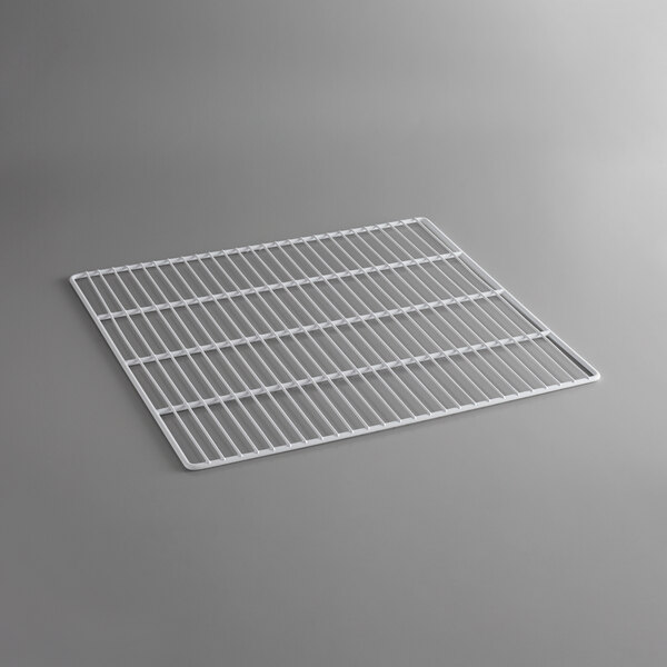 A white coated wire shelf on a gray background.