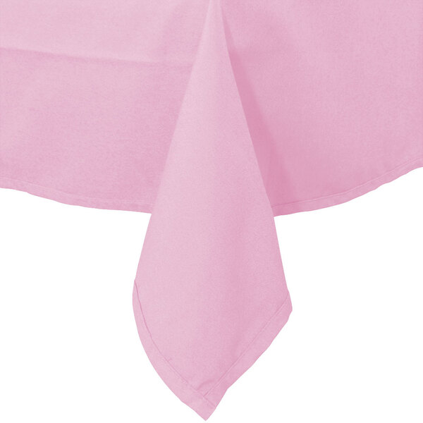 A close-up of a folded pink Intedge cloth table cover.