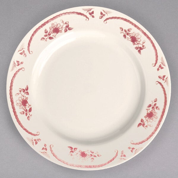 A white Homer Laughlin china plate with red flowers.