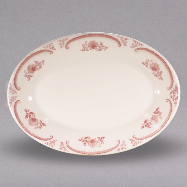 A white Homer Laughlin china platter with red flowers.