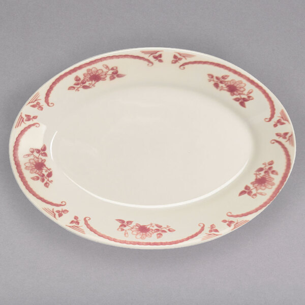 A white Homer Laughlin china platter with pink flowers on it.