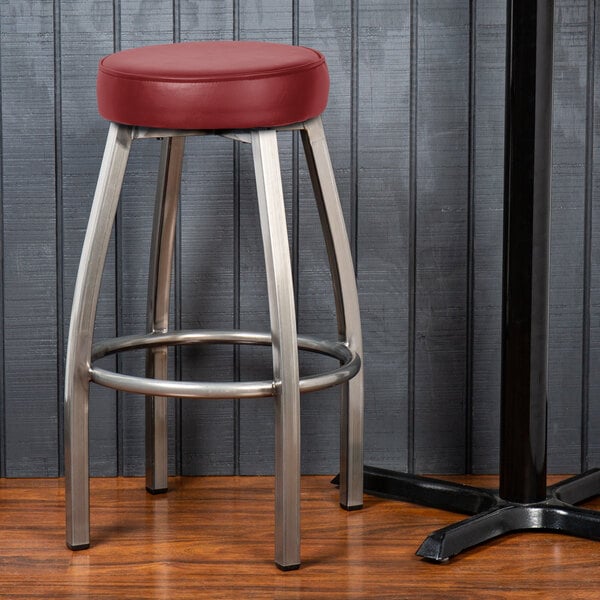 Lancaster Table & Seating Clear Coat Swivel Backless Bar Stool with Maroon Vinyl Seat