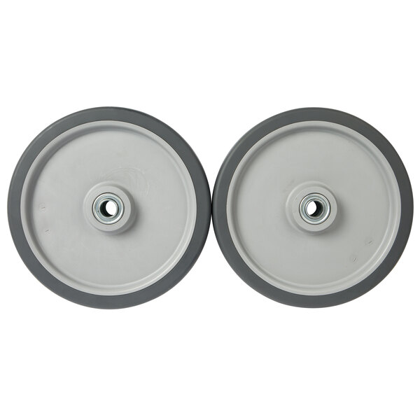A pair of gray 10" wheels for a tilt truck with a rubber rim and a hole in the center.