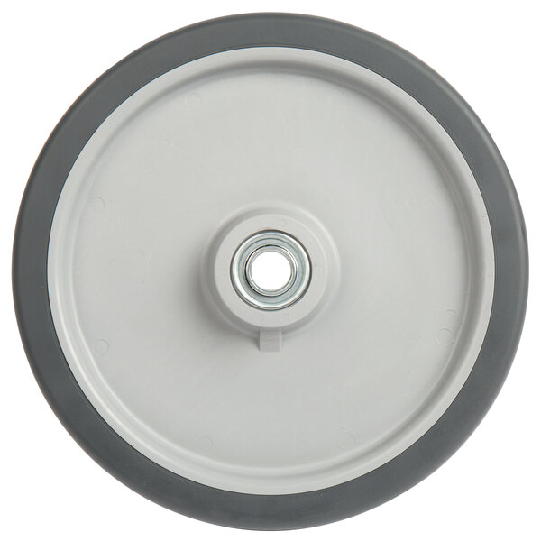 A gray 10" Heavy-Duty Tilt Truck wheel with a round center and a hole in it.
