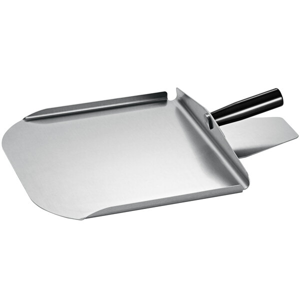 A metal oven paddle with sides on a counter in a professional kitchen.