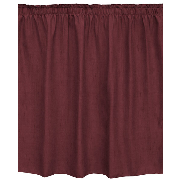 A burgundy Snap Drape table skirt with ruffled edges.
