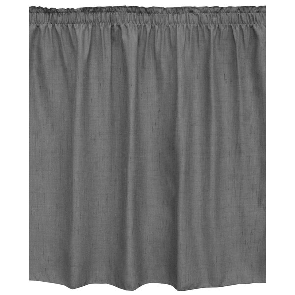 A grey table skirt with ruffled edges.