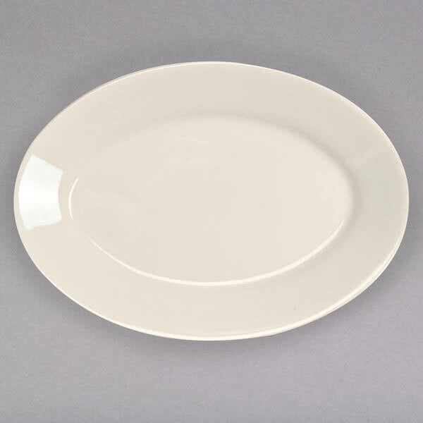 A white Homer Laughlin China oval platter with a rim.