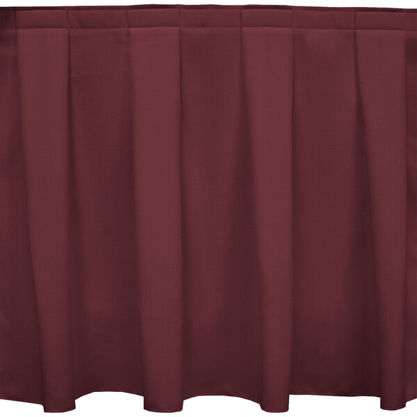 A burgundy Snap Drape box pleat table skirt with Velcro clips.