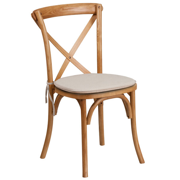 A Flash Furniture oak wood banquet chair with a cushion.