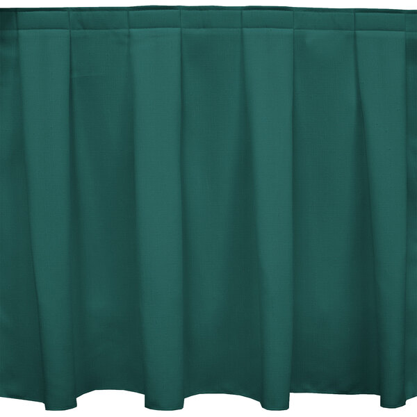 A Caribbean green Snap Drape box pleat table skirt with velcro clips.