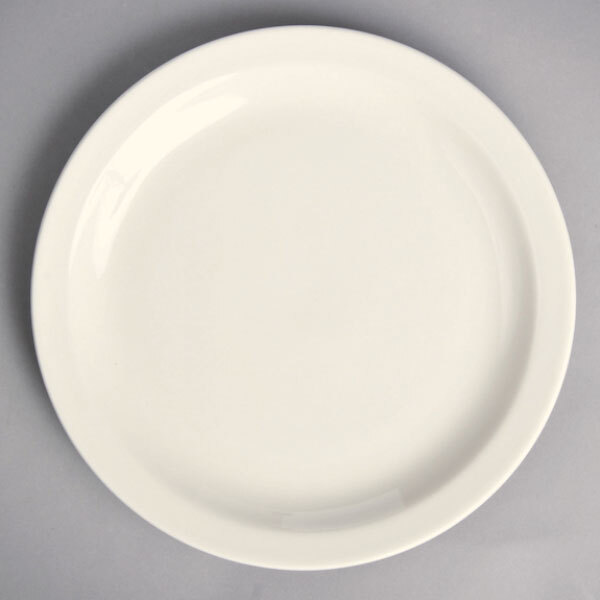 A white Homer Laughlin china plate with a narrow white rim on a gray surface.