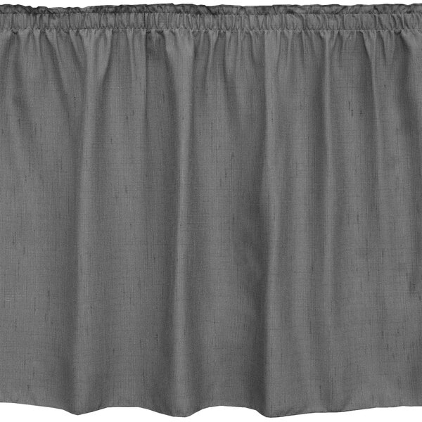 A charcoal grey Snap Drape table skirt with ruffled edges.
