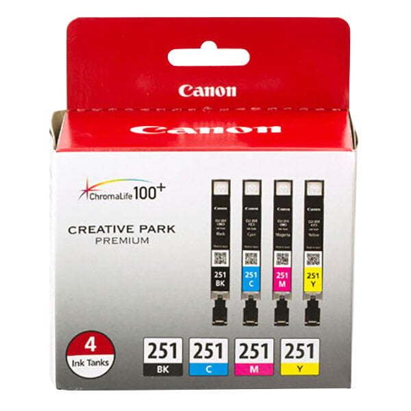 A box of Canon printer ink cartridges in black, cyan, magenta, and yellow. The box has a red and white Canon logo.