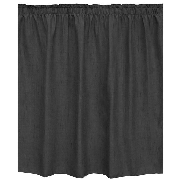 A black table skirt with ruffled edges.