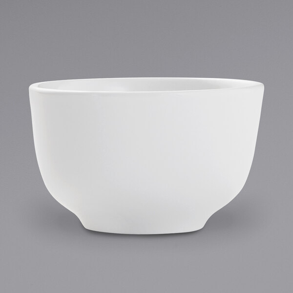An Arcoroc white porcelain bouillon cup with a handle on a white background.