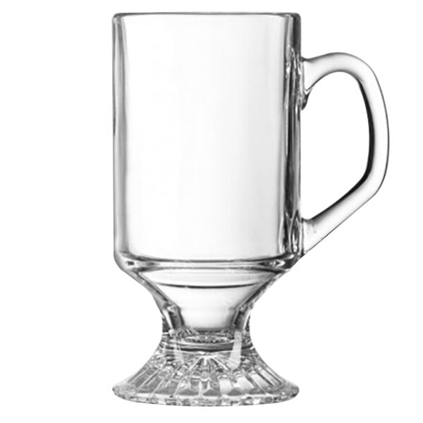 An Arcoroc clear glass Irish coffee mug with a handle.