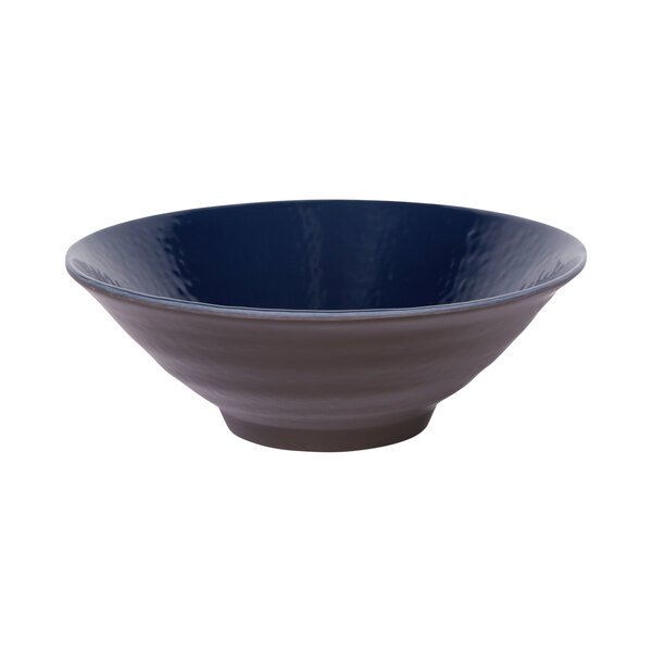 An Elite Global Solutions Durango melamine bowl with a white background and a dark blue rim.