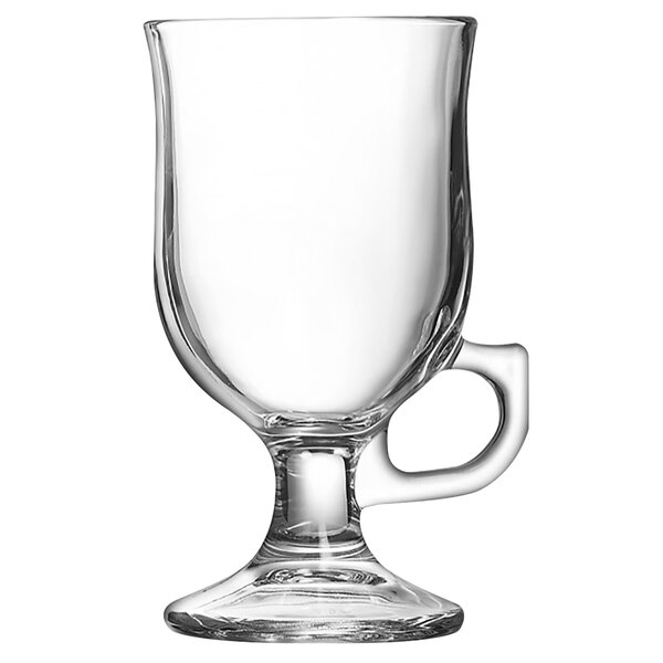 An Arcoroc tempered glass Irish coffee mug with a handle.