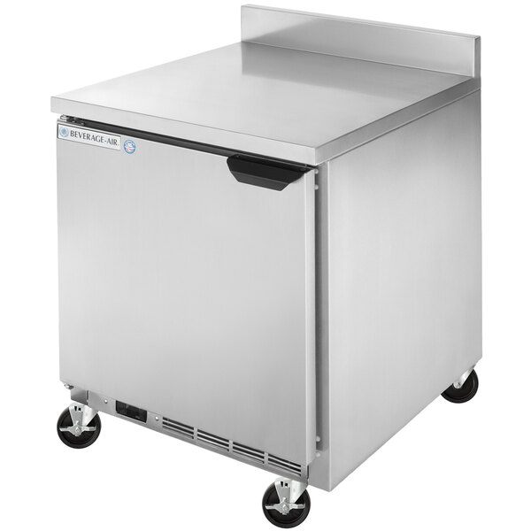 A silver Beverage-Air worktop refrigerator with wheels.