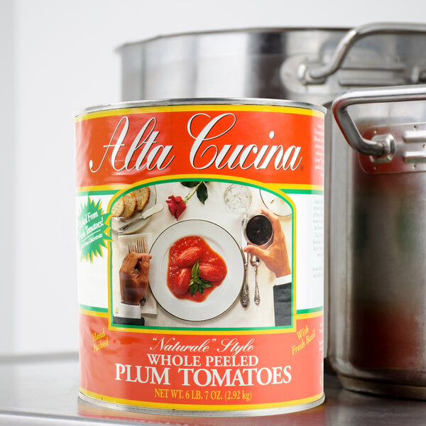 A can of Stanislaus Alta Cucina Naturale Style Plum Tomatoes on a table.