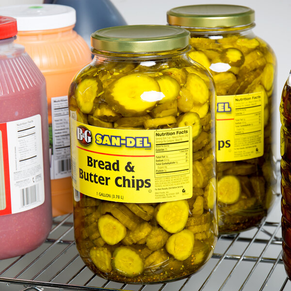 A rack of B&G 1 gallon jars of bread and butter pickle chips.