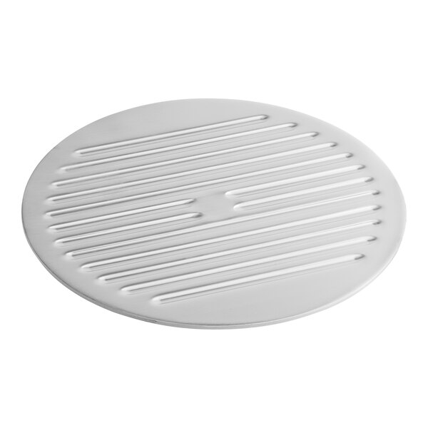A round white metal blade cover with lines on it.