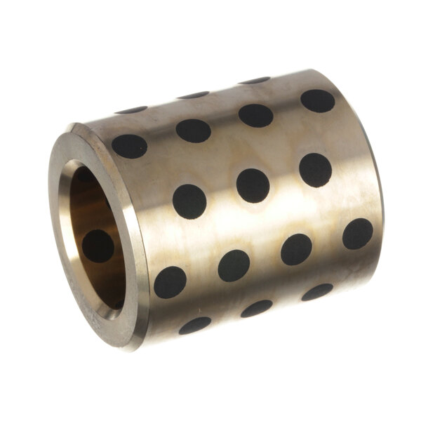 A metal cylinder with a black circle and brass polka dots.