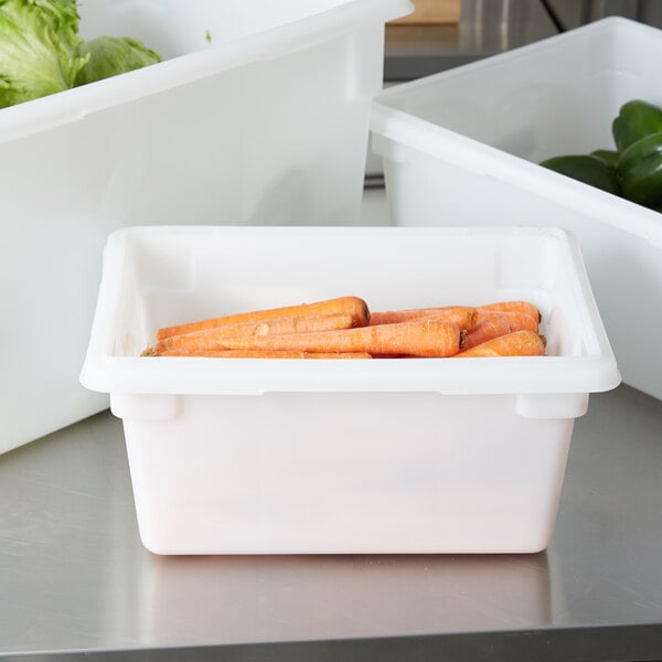 A white Rubbermaid food storage container with carrots in it.