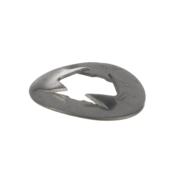 A close-up of a Whirlpool Ener Push Nut, a metal object with a broken circle in it.
