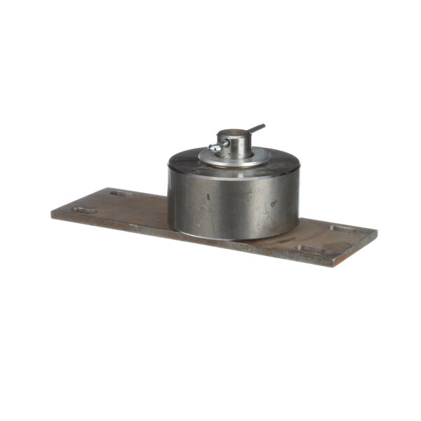 A round metal plate with a metal roller assembly on top.