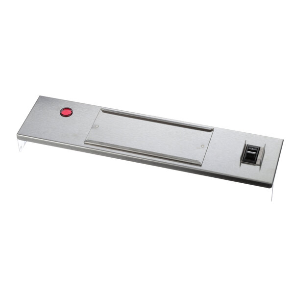 A rectangular metal plate with a red button on it.