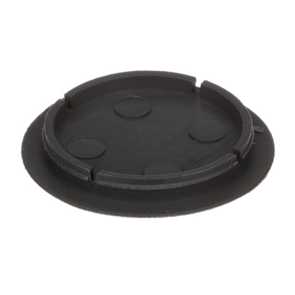 A black circular object with holes.