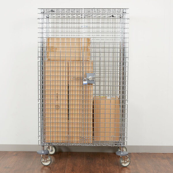 A Metro wire security cabinet filled with boxes on a cart.