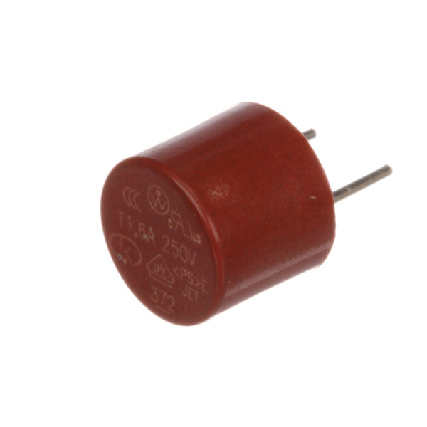 A close-up of a red capacitor with white text on it and two metal pins.