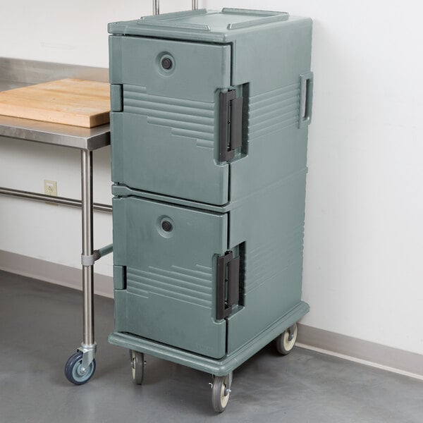 A slate blue Cambro Ultra Camcart, a large grey plastic container on wheels.